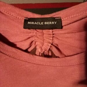 Pink high low lady's top with cutout back